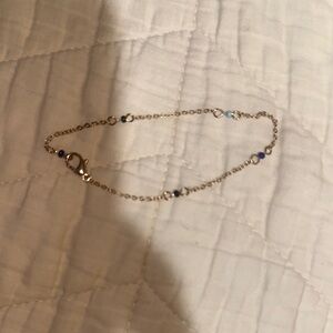 Elegant Gold and Purple Bracelet